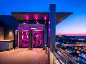 a balcony of a building with purple lights at Hilton Prague Atrium in Prague