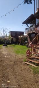 a dirt road next to a house with a yard at Posada "Villa Biker" in Villa del Carbón
