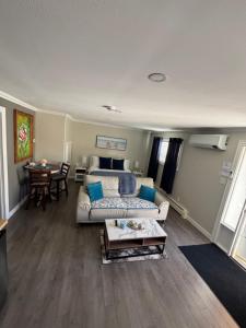 a living room with a couch and a table at Emmas place in Halifax