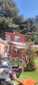 a group of motorcycles parked in front of a house at Posada "Villa Biker" in Villa del Carbón