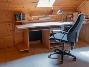 an office with a desk and a chair at Apartment Haggen by Interhome in Oberegg