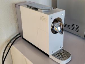 a washing machine sitting on top of a counter at Apartment Tgèsa Val by Interhome in Sedrun +9 photos