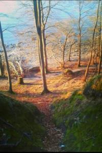 a painting of a path in a forest with trees at Apartment Florö by Interhome in Putbus +2 photos
