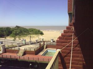 a balcony with a swimming pool and a beach at SAN CLEMENTE RIAZOr 6 in San Clemente del Tuyú +1 photo