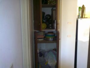 a kitchen pantry with a shelf with food on it at SAN CLEMENTE RIAZOr 6 in San Clemente del Tuyú