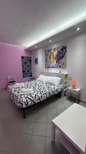 a bedroom with a large bed in a room at La Casa del Torrente in Rieti