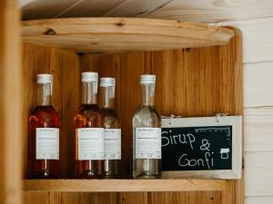 a wooden shelf with bottles of wine on it at Apartment Hof Obertalgut by Interhome in Teuffenthal