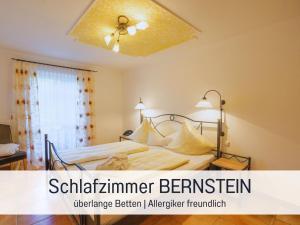 a bedroom with a bed with a ceiling fan at Apartment BERNSTEIN by Interhome in Wertach