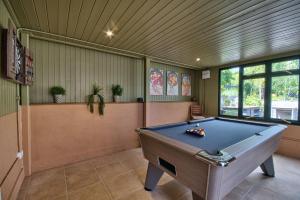 a billiard room with a pool table in it at Olive Orchard in Cropredy