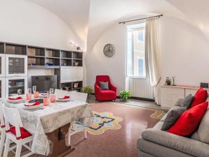 a living room with a table and chairs at Apartment Emanuela by Interhome in Alassio