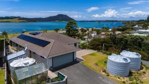 an aerial view of a house with a solar roof at Hook'em Heights in Pukenui