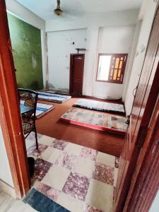 an empty room with several rugs on the floor at Dream Hostel Sukkur in Sukkur