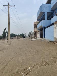 an empty parking lot in front of a building at Dream Hostel Sukkur in Sukkur