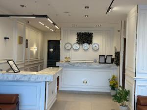 a kitchen with white counters and plates on the wall at White Pyramids inn in Cairo
