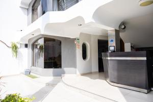 a lobby of a building with a reception counter at San Miguel Awanka Hotel in Lima +43 photos