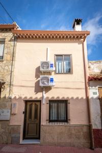 a house with two boxes on the side of it at Casa Abilio Rodenas in Alborea