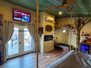 a room with a swing in a house at "Morning Wood" Luxury Treehouse Retreat Near Dollywood & Pigeon Forge in Sevierville