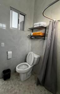 a bathroom with a toilet and a shower curtain at Tutis Home Domo-Estadio BBVA-ArenaMty Apart2dopiso in Monterrey