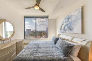 a bedroom with a bed and a large window at Hanover BLVD Place in Houston