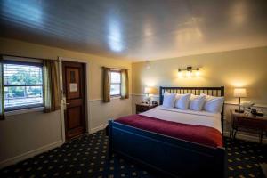 a hotel room with a bed and a window at Delta King Hotel in Sacramento