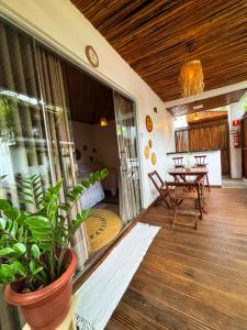 a living room with a table and a dining room at Villa Sairé in Alter do Chao