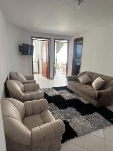 a living room with two couches and a couch at Siga Sumercé Apartamento completo centro de Duitama in Duitama