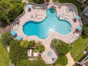 an overhead view of a swimming pool with chairs and a pool at Lakeview 2 suites 6 min to New EPIC Universe in Orlando