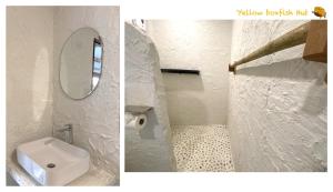a white bathroom with a toilet and a mirror at Yellow Boxfish Hut in Ban Thong Phlu +14 photos
