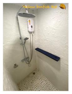 a shower in a corner of a bathroom at Yellow Boxfish Hut in Ban Thong Phlu