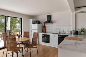 a kitchen with a table and chairs and a dining room at An Unforgettable View in Dixons Creek