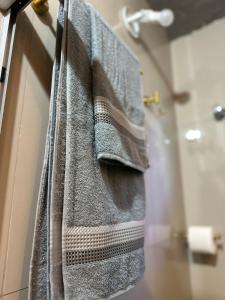 a towel hanging on a door in a bathroom at Gold Stay Residence 2 in Belo Horizonte +22 photos