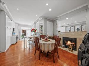 a dining room with a table and a fireplace at May House in Washington, D.C.