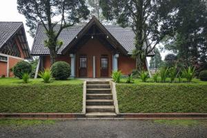 a house with stairs in front of it at Villa Argapuri Hills in Ciwidey +7 photos