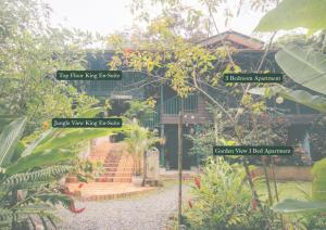 a sign in front of a house with some plants at Casa de Mono Bocas in Big Creek +50 photos