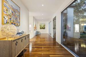 a hallway of a home with a large glass wall at Edgewater in Balnarring Beach