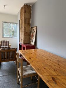 a living room with a wooden table and a couch at Faraya square chalet in Fārayyā