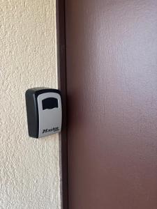 a black and white switch on the side of a wall at Apparte 104 avec Jacuzzi in Cap d'Agde