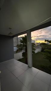 a view from the balcony of a house at Suíte por do sol 2 casa compartilhada in Xangri-lá
