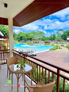 a view of a pool from the balcony of a resort at Kenjelo Farm and Recreation Resort in Dullan