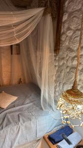 a bedroom with a bed with a canopy at Desapegue & Viva Bed and Bikes in Ilhéus