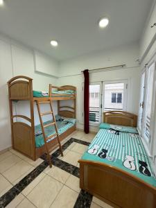 a room with two bunk beds in a room at Nabi Daniel Residence بيت البنات in Alexandria