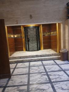 a door in a building with a tile floor at Nabi Daniel Residence بيت البنات in Alexandria
