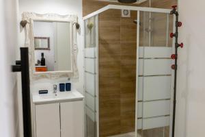 a bathroom with a sink and a mirror at Studio le nid avec piscine partagée in Flayosc