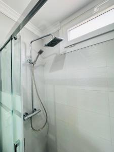 a shower in a bathroom with a glass shower at BEACH FRONT APARTMENT in CALA MARSAL with the SEA VIEW ! in Portocolom +50 photos