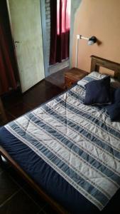 Una cama o camas en una habitación de La Casita de Sil