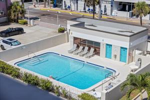 an overhead view of a swimming pool next to a building at Boardwalk 401 in Cocoa Beach