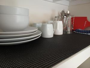 a group of plates and cups sitting on a counter at Wattleview in Lithgow +19 photos