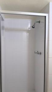 a shower with a glass door in a bathroom at Hotel Segovia in Tijuana