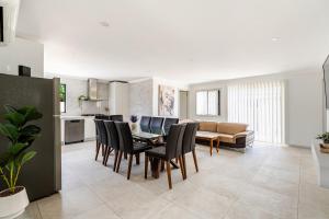 a kitchen and dining room with a table and chairs at Brand new fully accessible 5 bedroom house in Fairfield