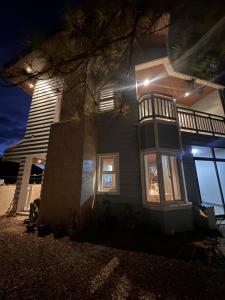 a house with lights on the side of it at night at Talna in Baguio